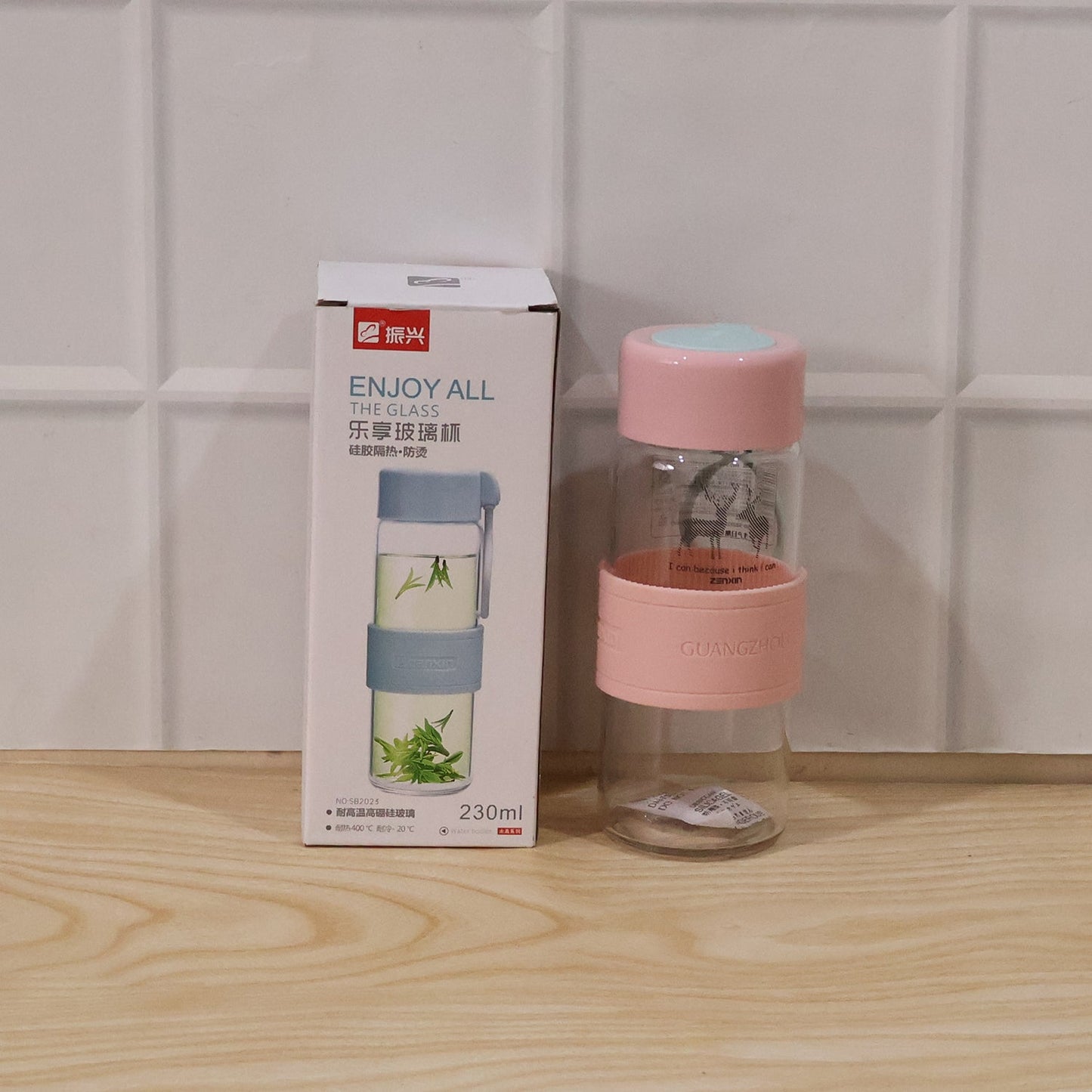 Wukusy portable glass water bottle with 230ml capacity, silicone sleeve, and carry strap for easy hydration on the go.