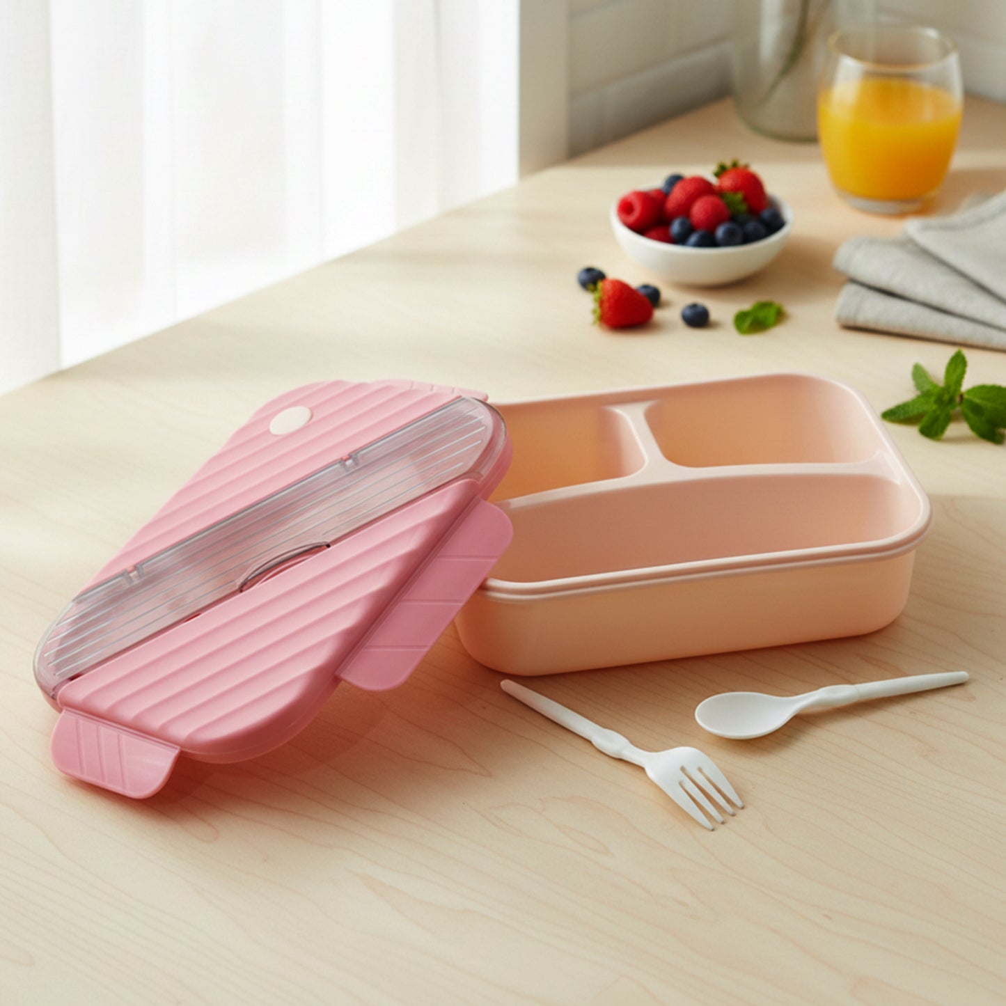 Plastic 3-compartment kids lunch box by Wukusy with colorful sections for snacks and meals, durable and lightweight for children.