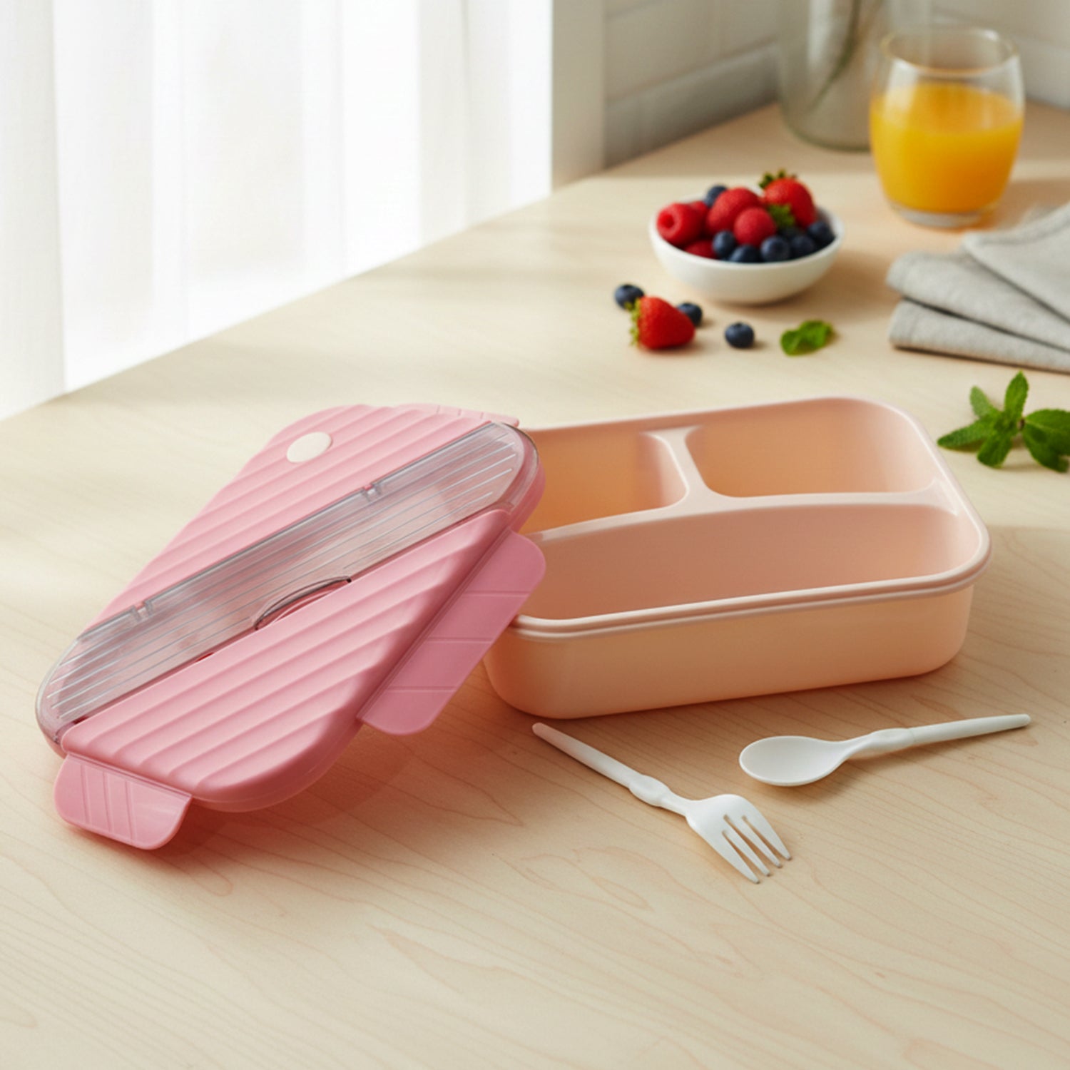 Plastic 3-compartment kids lunch box by Wukusy with colorful sections for snacks and meals, durable and lightweight for children.