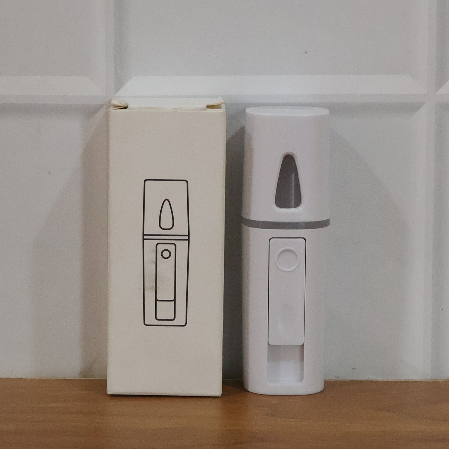 Wukusy portable nano mist humidifier sprayer emitting a fine mist, compact design ideal for personal moisture hydration.