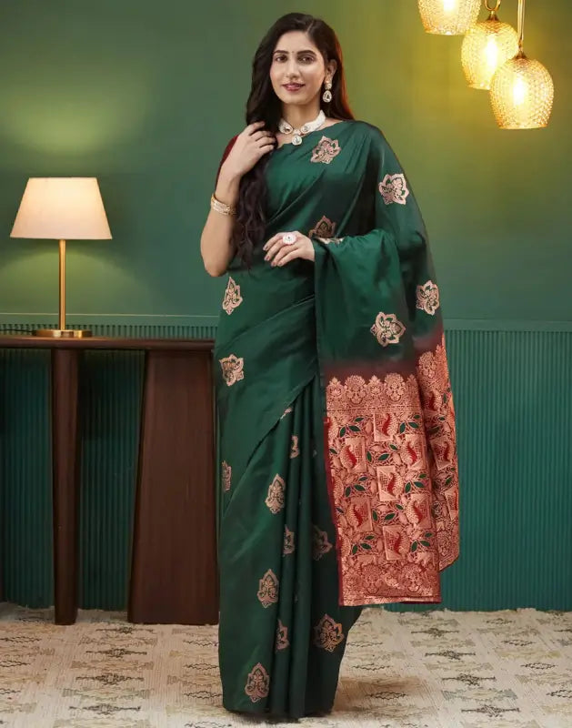 Elegant green silk saree from Ekom's Royal Green Golden Elegance Collection, featuring intricate golden embroidery for women.