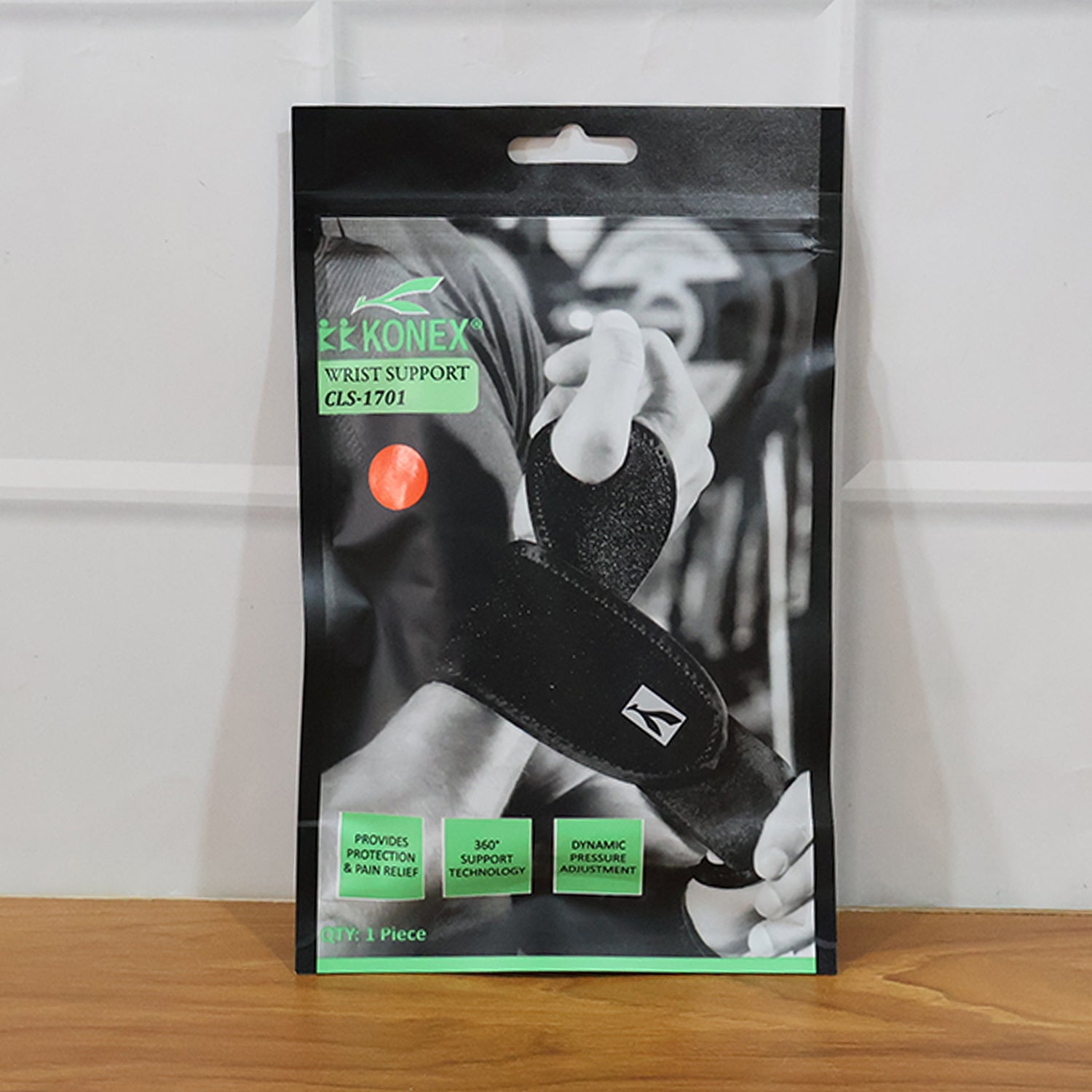 Wukusy adjustable wrist support brace for sports, shown in black with adjustable straps on a white background.