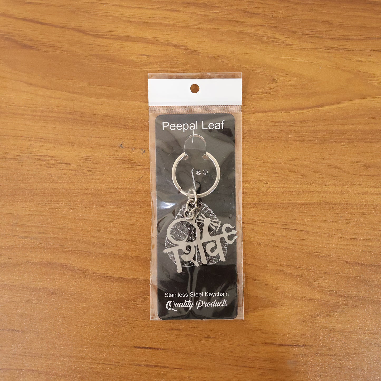 Metal Shiv design keychain featuring intricate Shivling motif, crafted by Wukusy, with a polished finish and detailed craftsmanship.