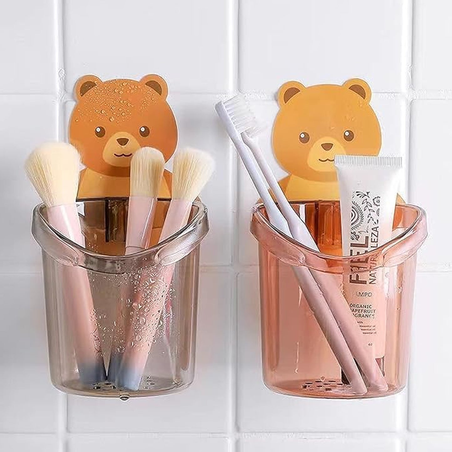 Three Wukusy teddy bear toothbrush holders for kids, colorful and cute, designed for bathroom organization and fun.