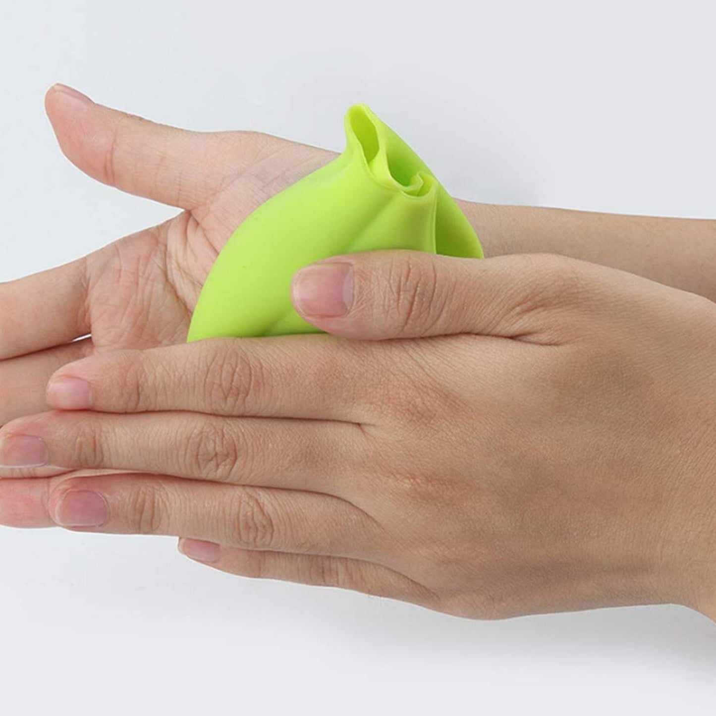 Wukusy 2205 Silicone Ginger Garlic Manual Peeler kitchen tool in use, showing textured silicone surface for easy peeling of ginger and garlic