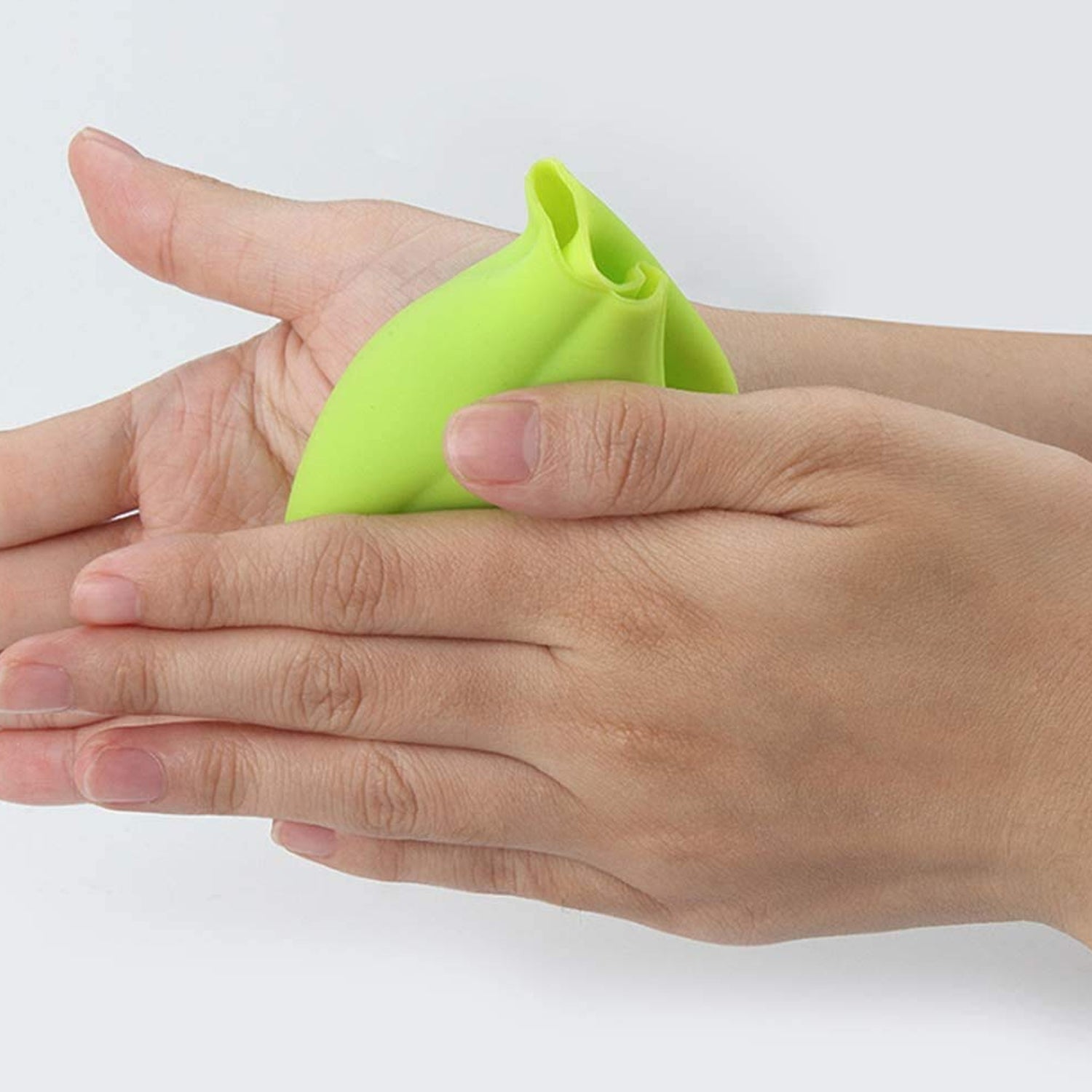 Wukusy 2205 Silicone Ginger Garlic Manual Peeler kitchen tool in use, showing textured silicone surface for easy peeling of ginger and garlic