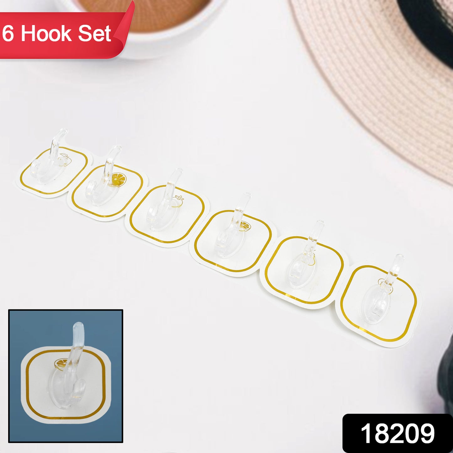 Set of six transparent adhesive wall hooks by Wukusy for home improvement, mounted on a wall for hanging items.