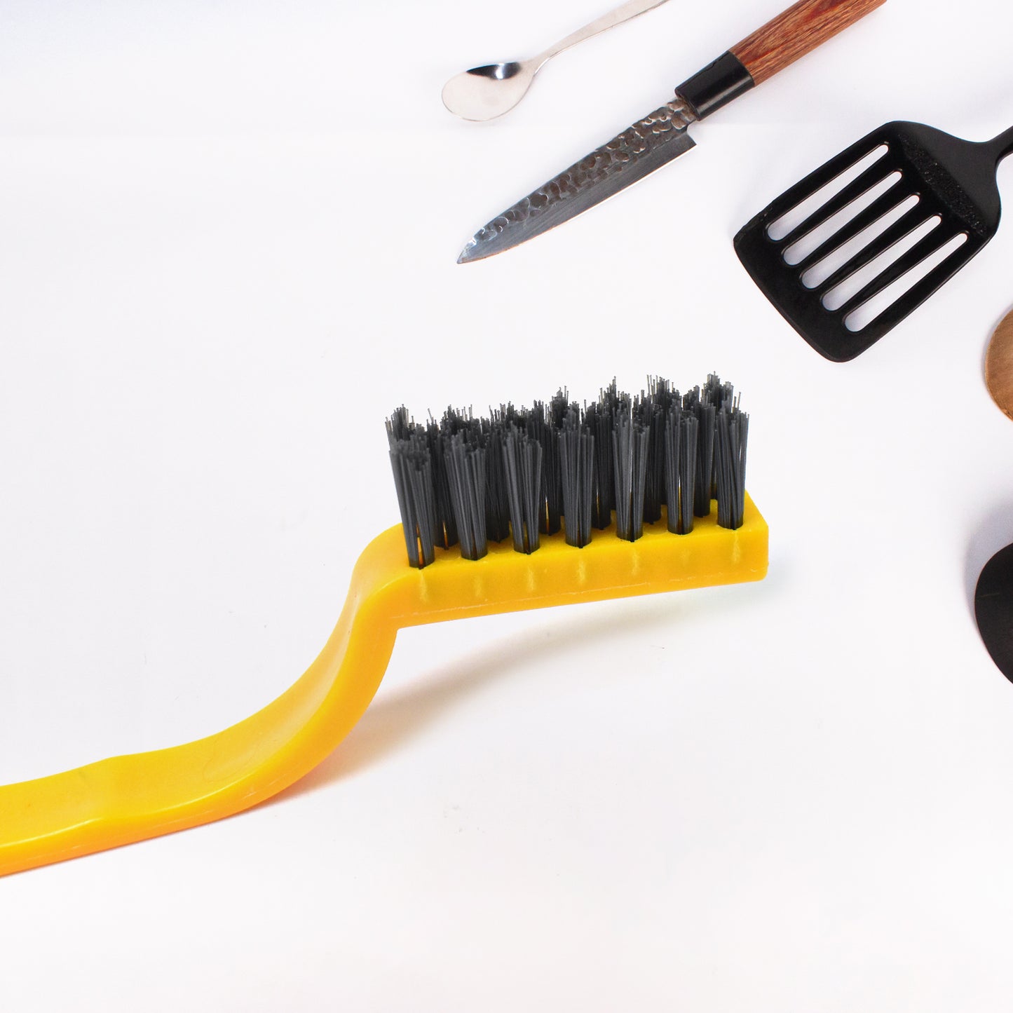 Wukusy mini nylon wire brush for cleaning, with a compact handle and stiff nylon bristles, ideal for home and kitchen tasks