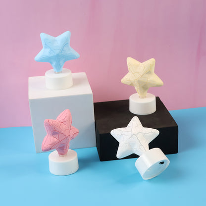 Set of four star-shaped LED tealight candles by Wukusy, decorative home decor lights with warm glow.