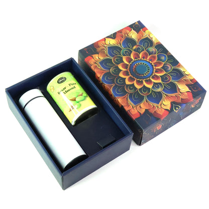 Wukusy Effete Kesar Pista Almonds gift hamper with golden accents, includes two decorative boxes and a bottle for home and kitchen.