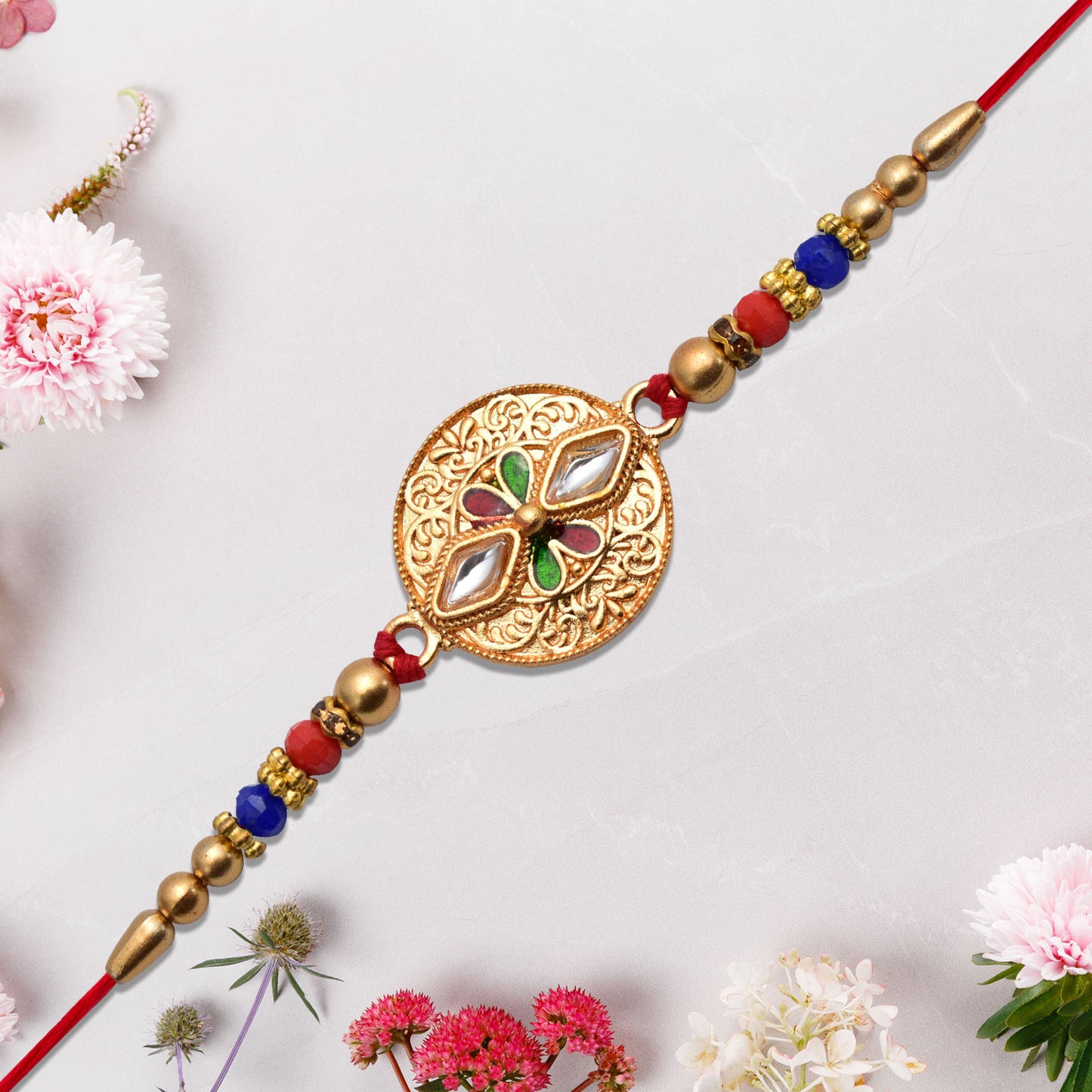 Antique finish Rakhi with intricate Meenakari and Kundan work, showcasing detailed craftsmanship in vibrant colors.