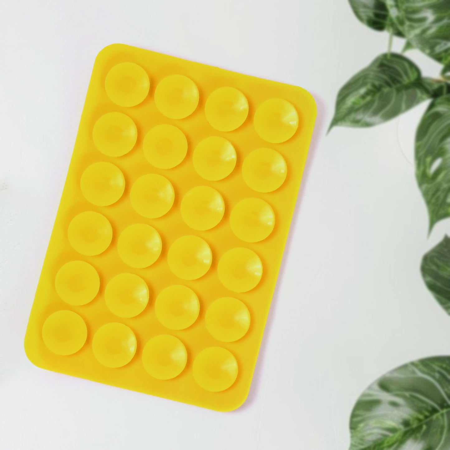 Wukusy suction phone case holder mount in mixed colors attached to a smartphone for secure hands-free use.
