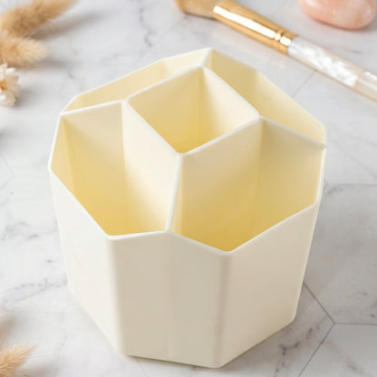 Wukusy 360-degree rotating desk organizer with multiple compartments for stationery and office supplies on a tidy workspace.