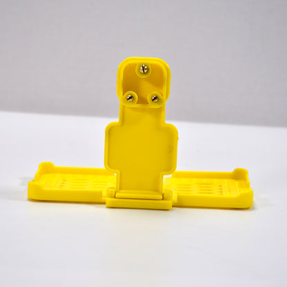 Yellow Wukusy 6498 multi-purpose wall holder stand for mobile charging, fits in socket and hangs devices securely.