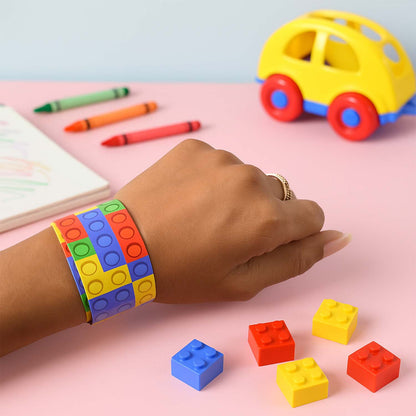 Colorful Snap Slap Bracelet Toy by Wukusy, featuring vibrant plastic segments that snap and slap onto wrists for fun and entertainment.
