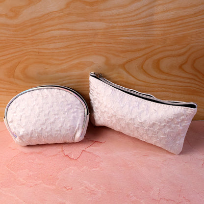 Wukusy 3-in-1 premium travel makeup bag set with multiple compartments and sleek design for organized cosmetics storage.