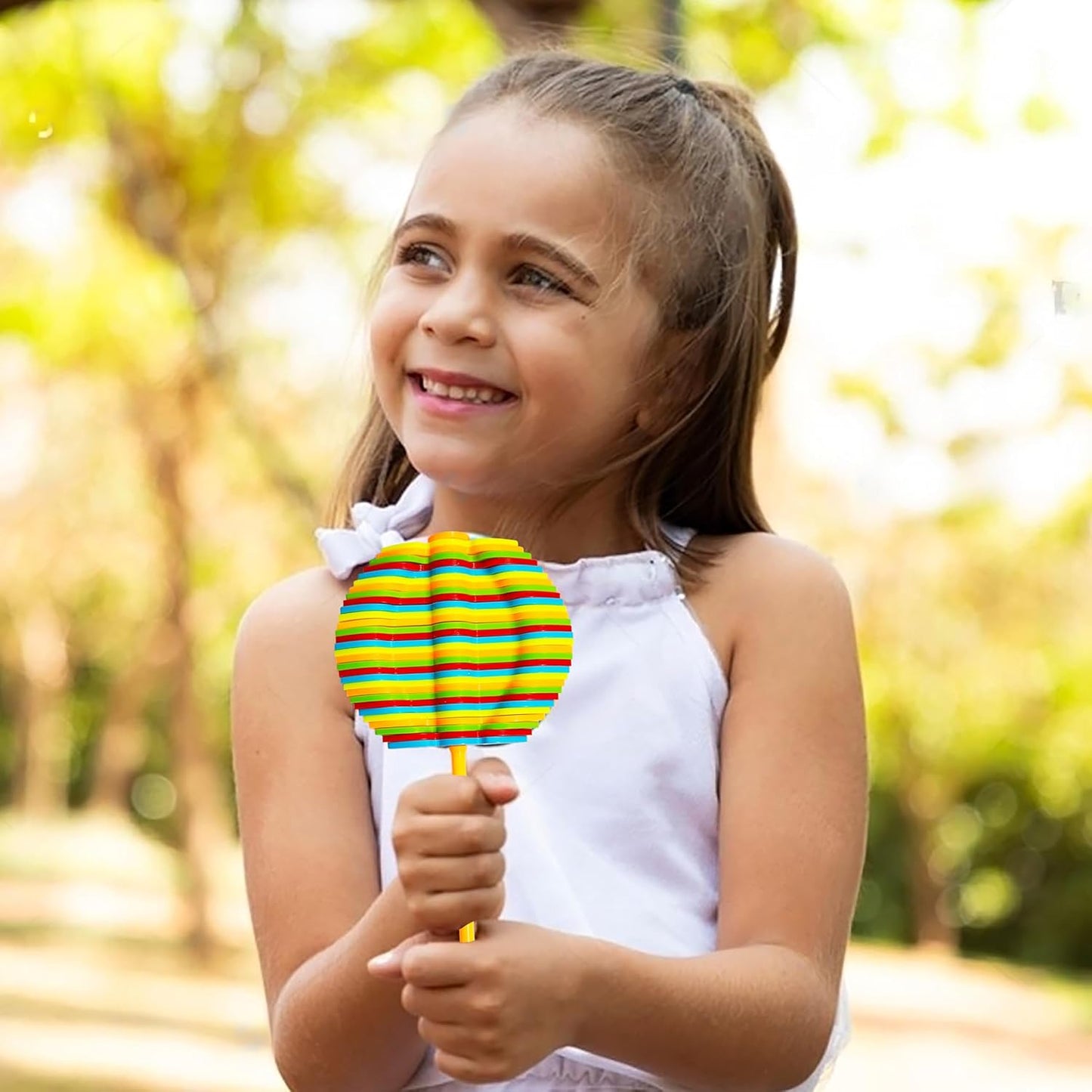 Colorful Spin Flower Candy rotating toy by Wukusy, featuring vibrant spinning flower design for kids' entertainment.