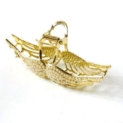 Wukusy premium pearl studded elegant hair claw clip for women, showcasing a stylish hair accessory with pearl accents.
