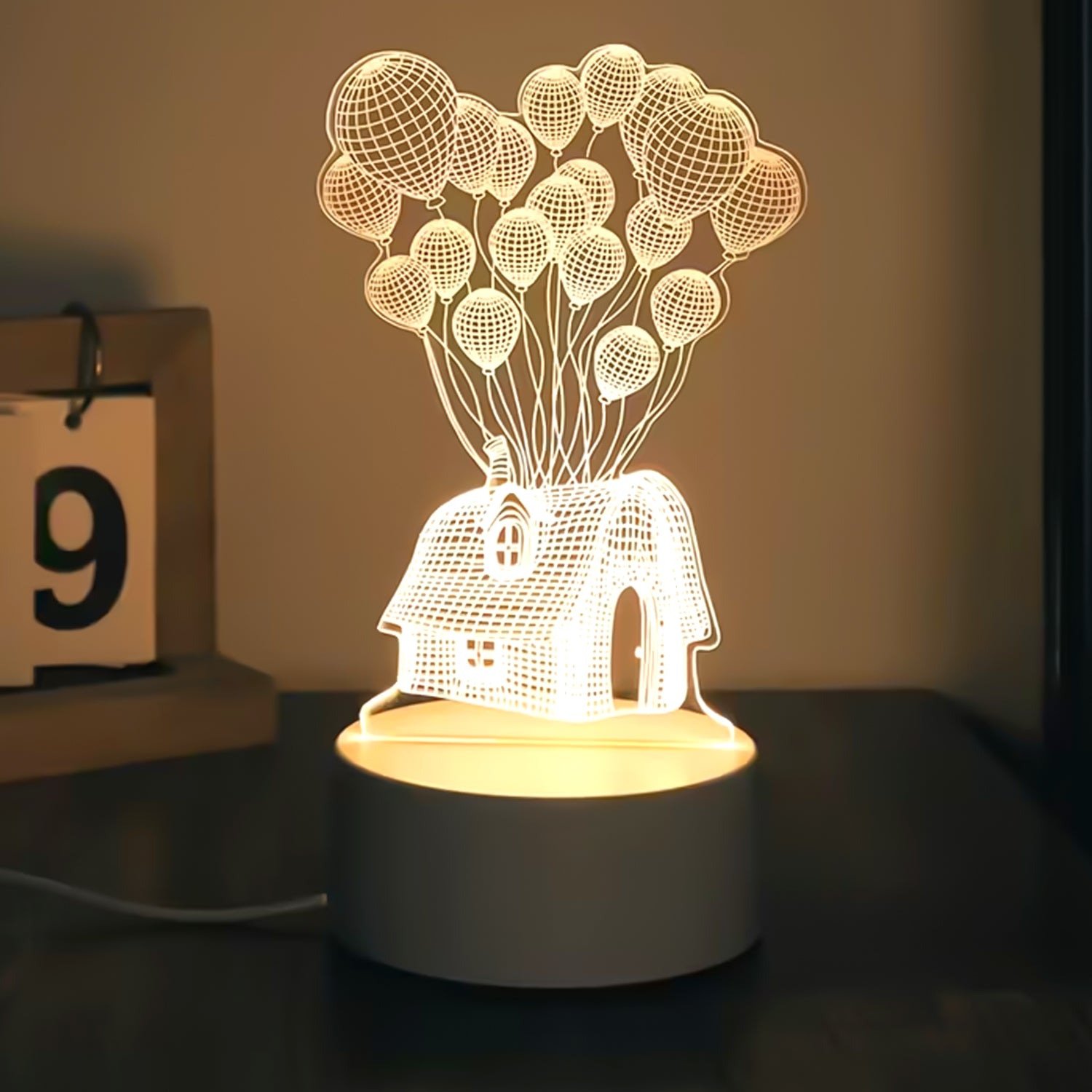Wukusy 3D illusion LED night lamp featuring a house and balloons design, perfect for home decor with a soft glowing light.