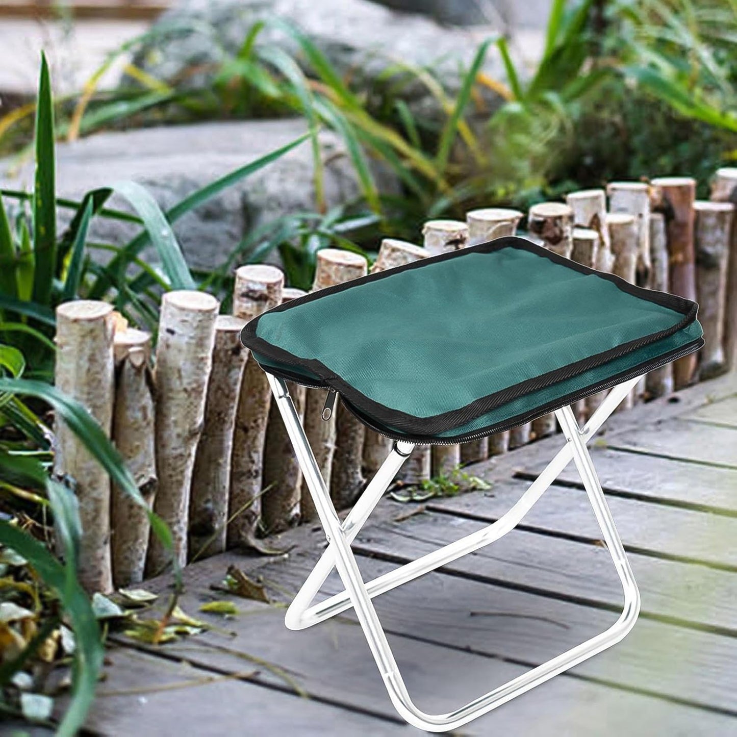Wukusy folding camping stool, collapsible portable seat for outdoor camping and travel, compact little camping stool on a grassy background