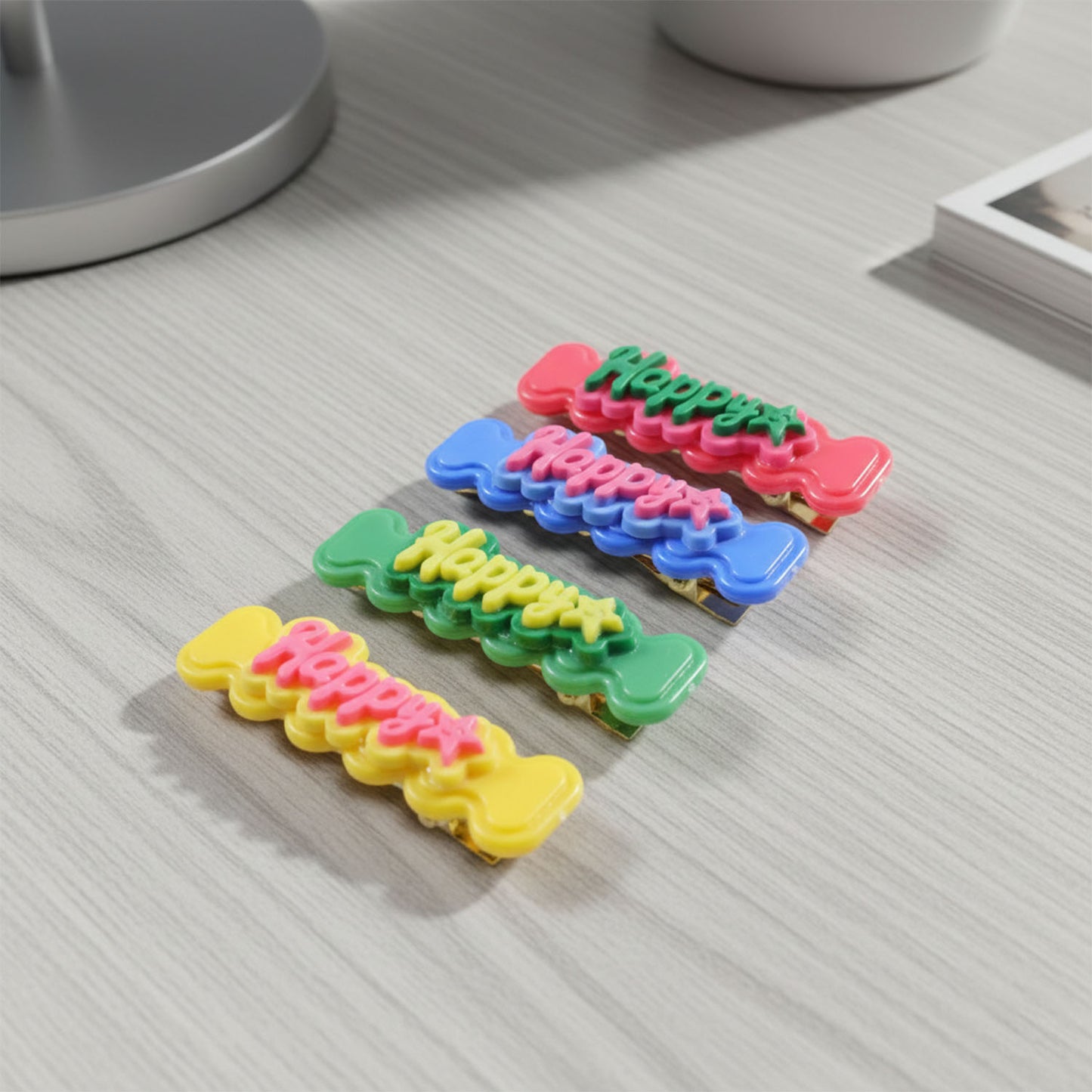 Set of four Wukusy cute happy bone-shaped snap hair clips featuring playful design for kids and teens.