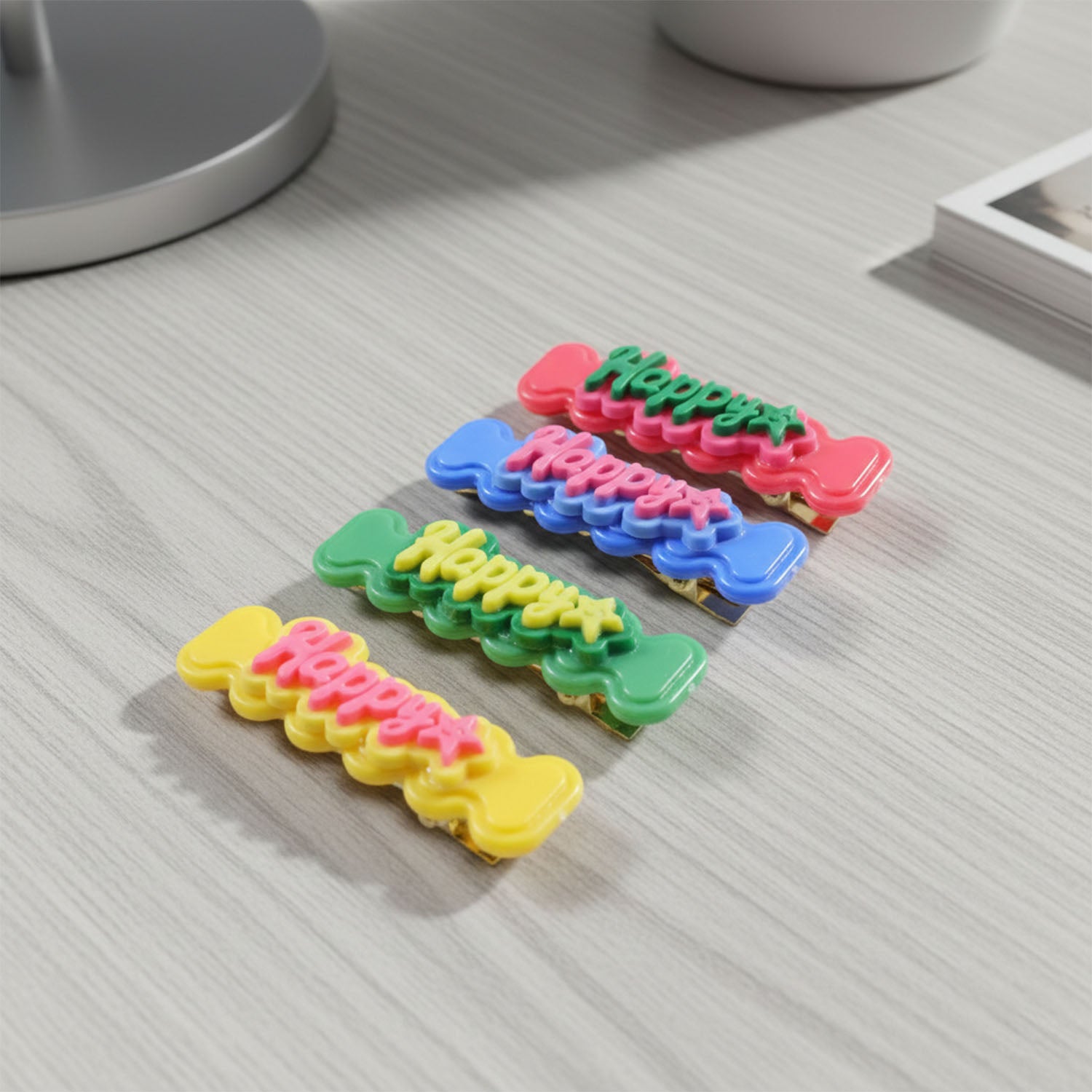 Set of four Wukusy cute happy bone-shaped snap hair clips featuring playful design for kids and teens.