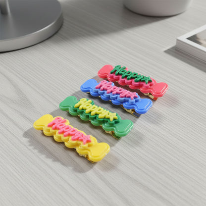 Set of four Wukusy cute happy bone-shaped snap hair clips featuring playful design for kids and teens.
