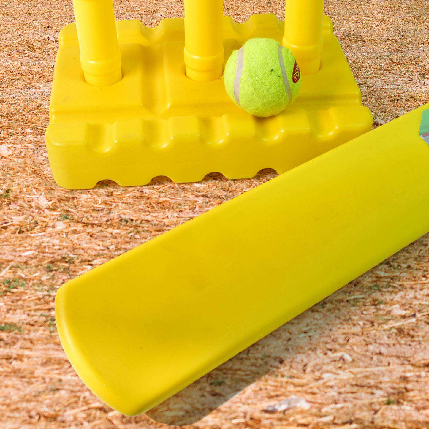 Wukusy cricket set with cricket bat, rubber ball, bails, three stumps, and stand base for outdoor sports play.