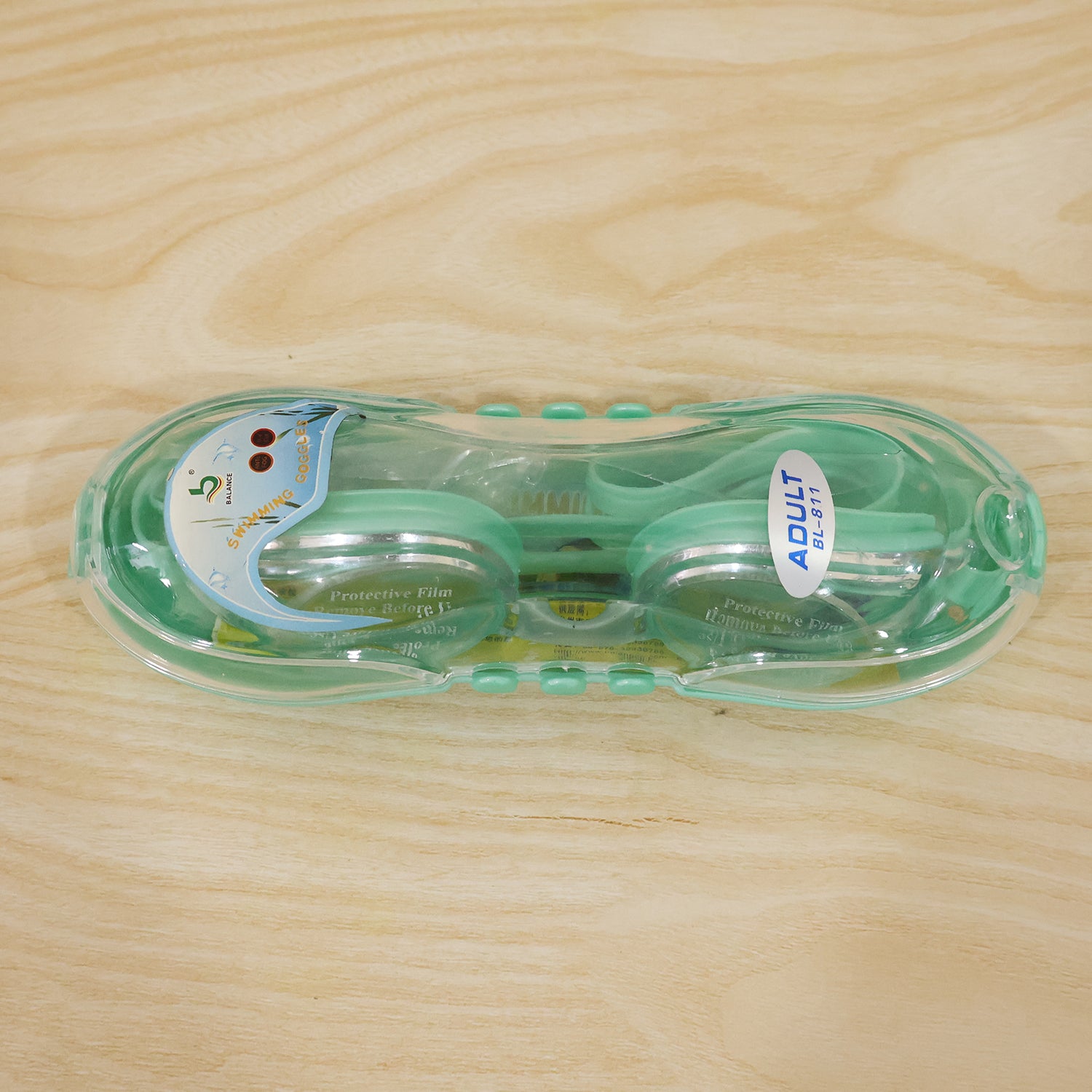 Kids anti-fog swimming goggles from Wukusy with adjustable strap and leak-proof design, shown on a child’s face.