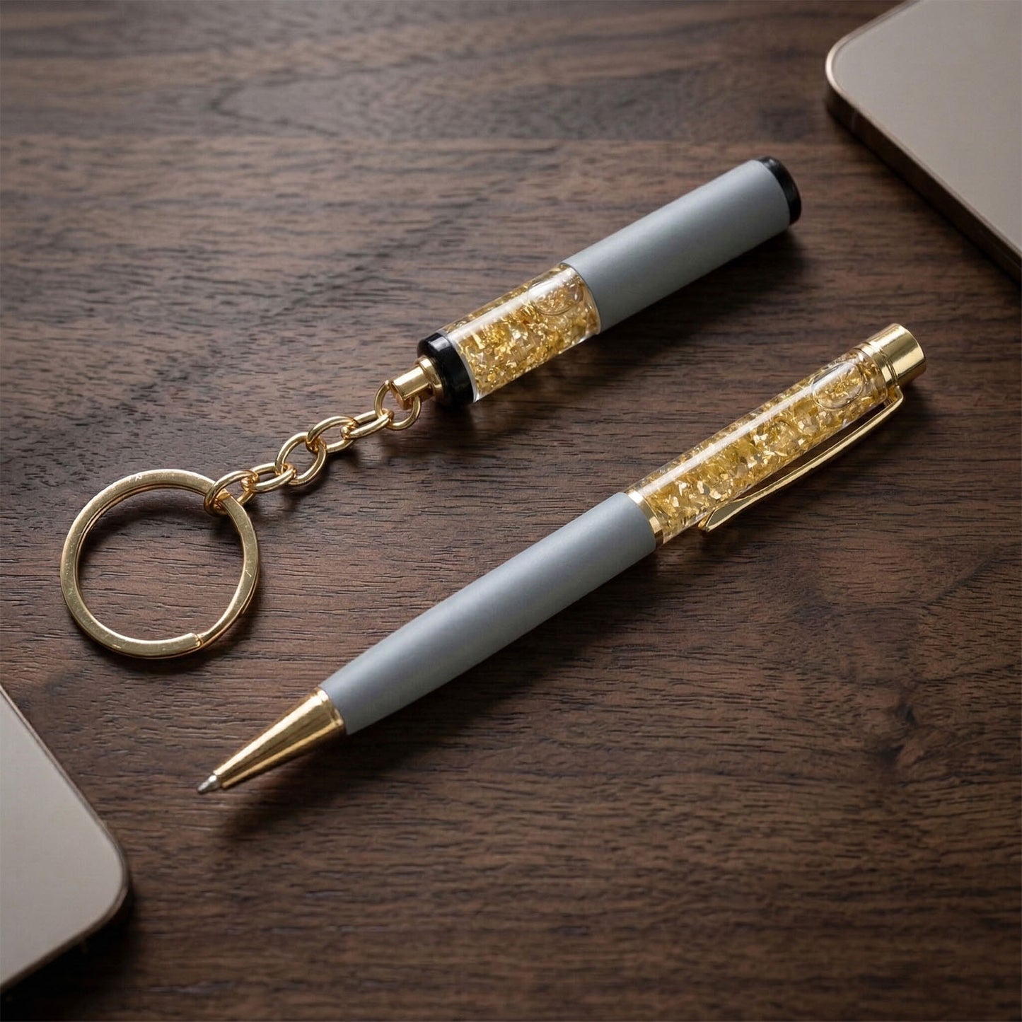 Wukusy Premium 2-in-1 keychain and pen combo gift set with silver keyring and black pen, placed on a white background.