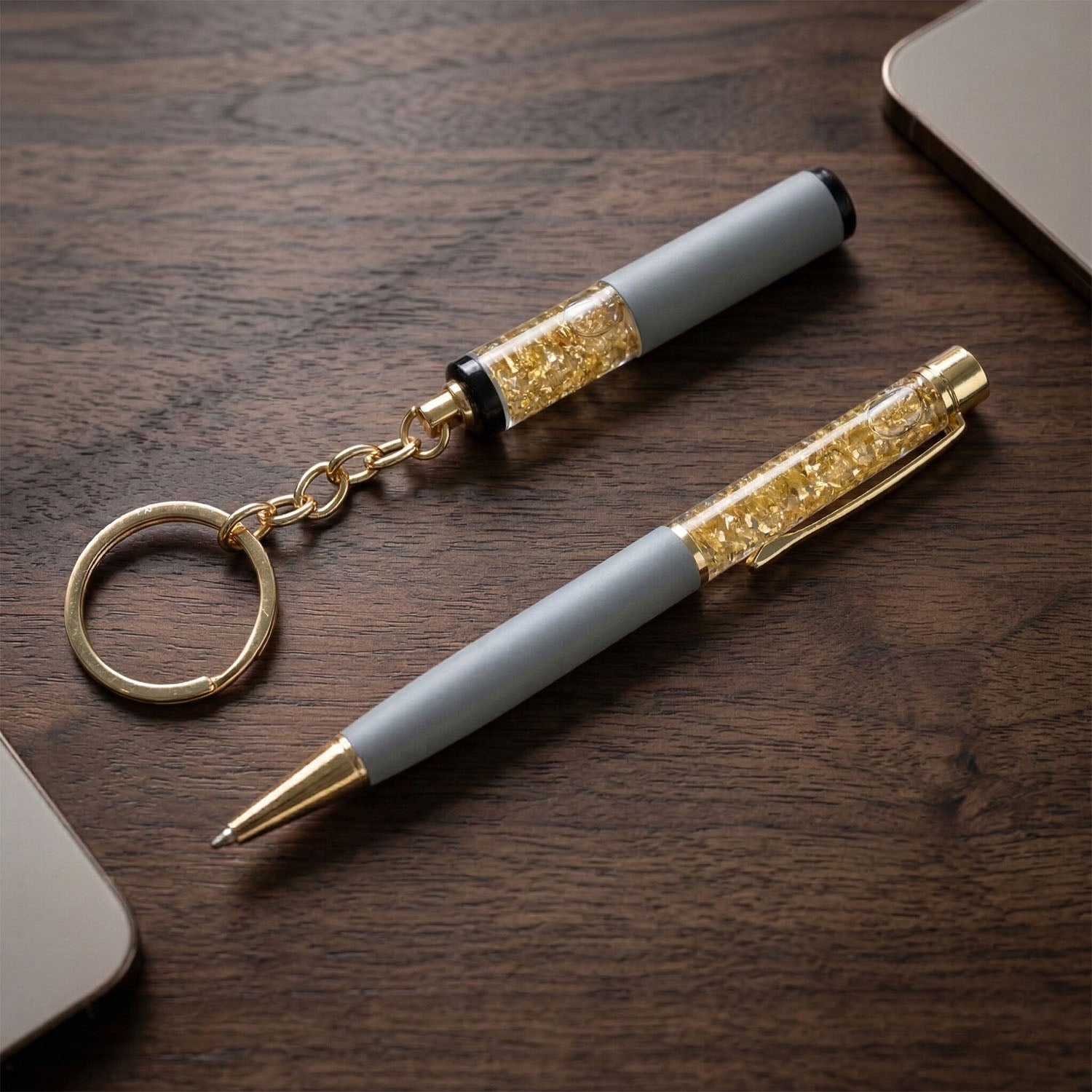 Wukusy Premium 2-in-1 keychain and pen combo gift set with silver keyring and black pen, placed on a white background.