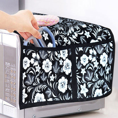 Wukusy microwave oven cover in neutral fabric, protects microwave from dust and splashes in kitchen setting.