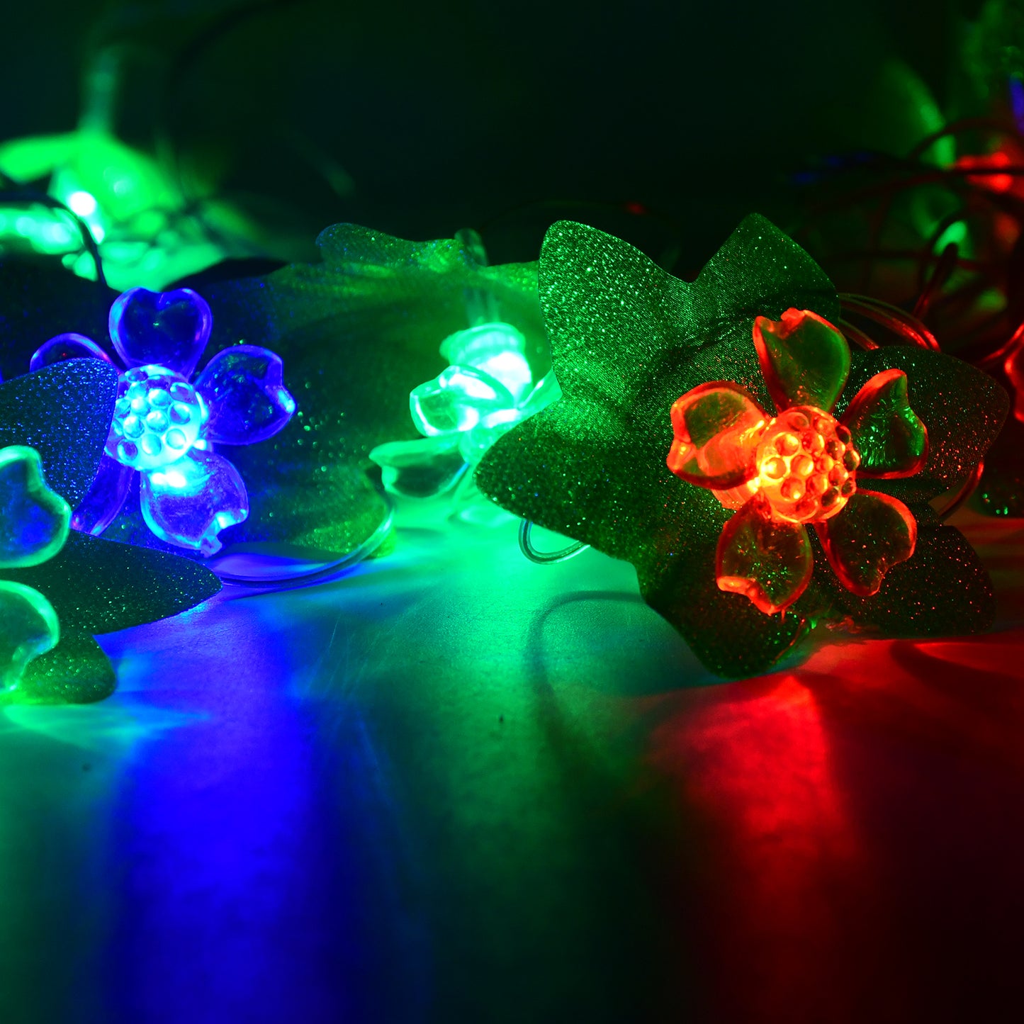 Wukusy leaf and flower LED decorative string light, 3 meters long, with warm glow bulbs arranged on a flexible wire for outdoor decor.