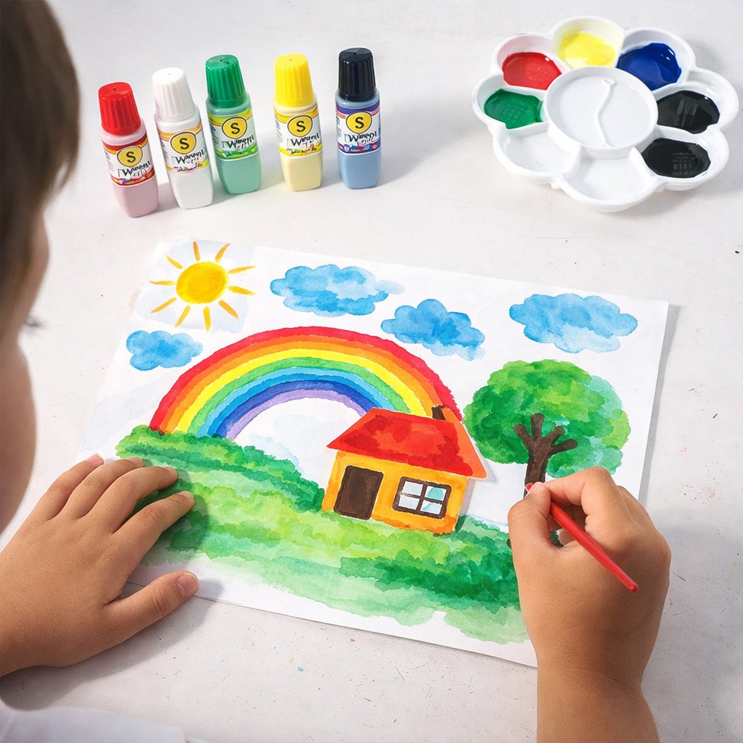 Kids water colour painting set by Wukusy with brushes and mixing palette, shown with vibrant paints and art supplies.