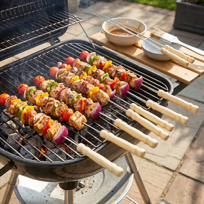 Set of 12 stainless steel BBQ skewers with wooden handles from Wukusy, ideal for grilling and outdoor cooking.