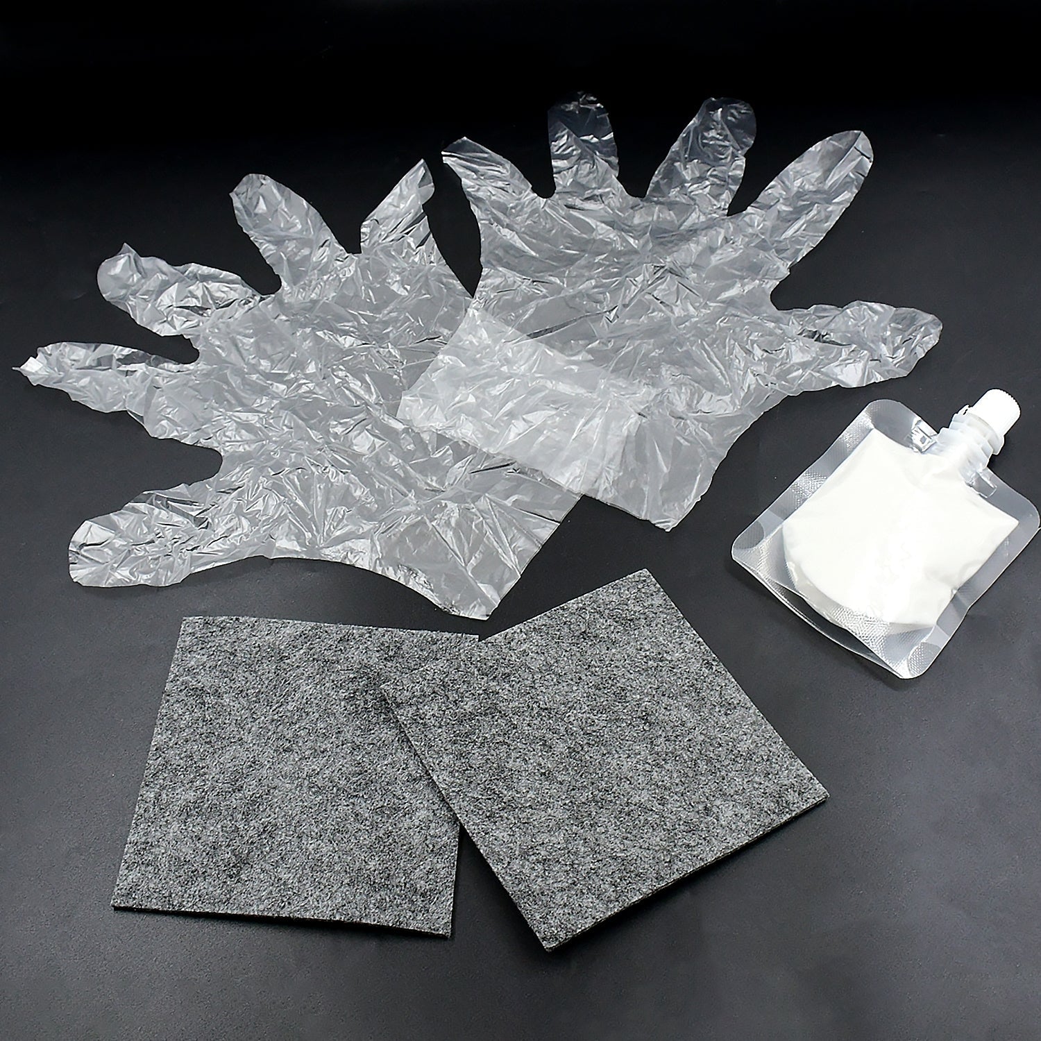 Wukusy Nano Magic Car Scratch Remover Cloth kit with repair solution, gloves, and polishing cloth for car paint scratch repair.