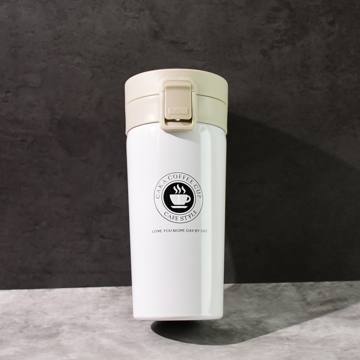Stainless steel vacuum insulated coffee flask with flip lock lid, 400ml capacity, by Wukusy, on a white background.