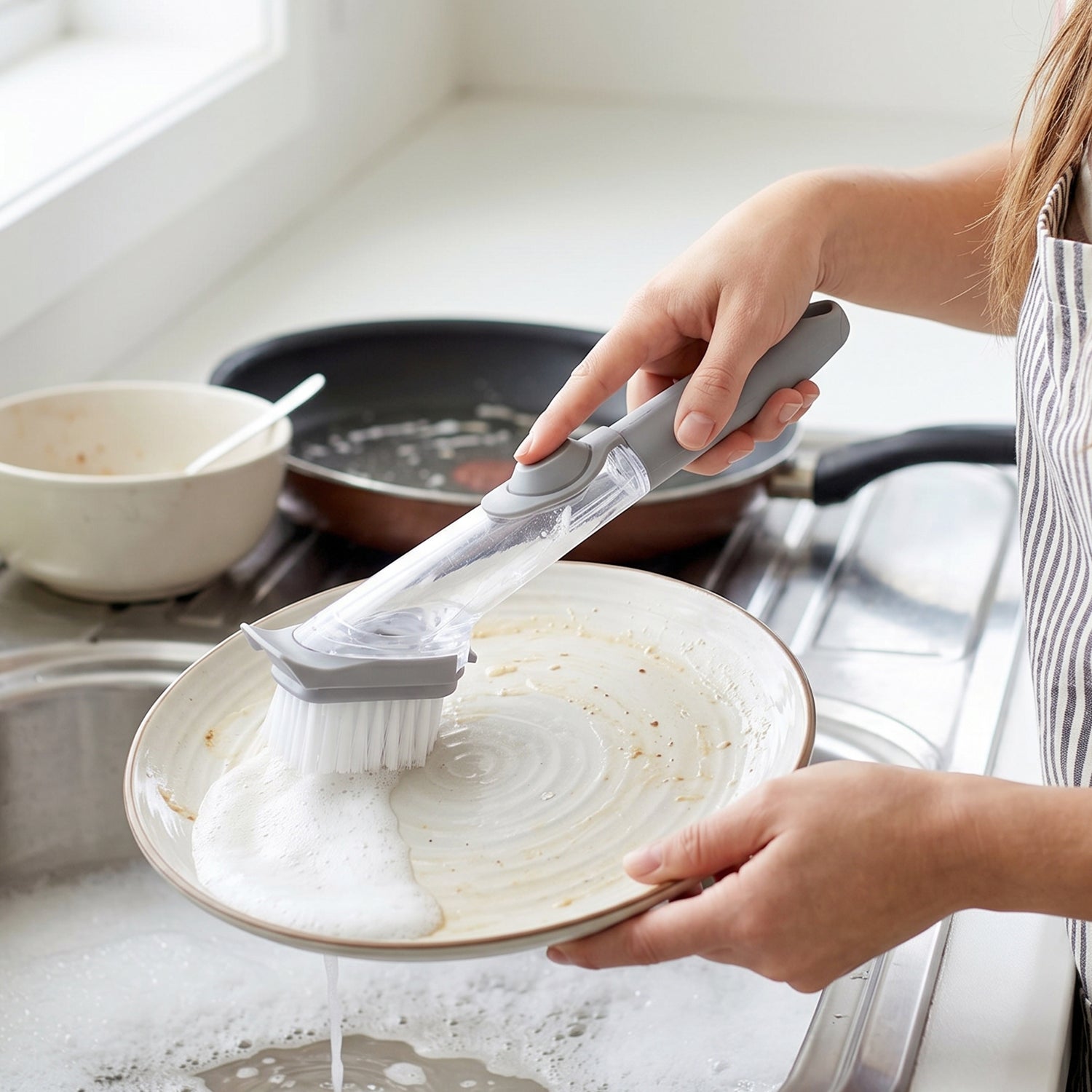 Refillable Wukusy soap dispensing dish scrub brush with handle, ideal for kitchen cleaning and scrubbing dishes.