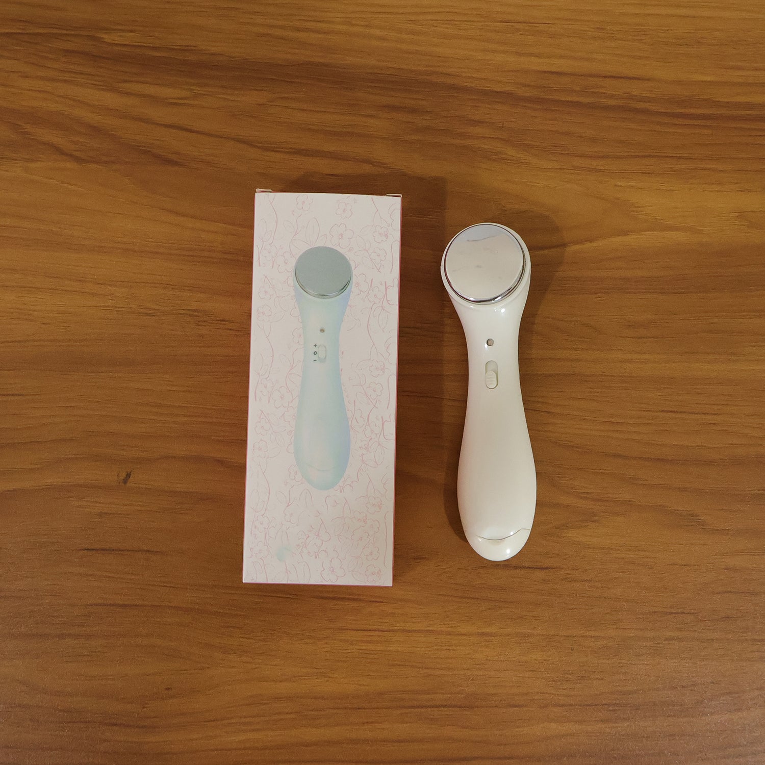 Wukusy portable facial massager device with sleek design, ideal for skincare and facial relaxation.