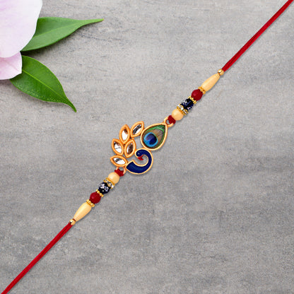 Colorful enamel artistic Mor Pankh Rakhi with traditional thread, featuring vibrant designs, from Wukusy fashion collection.