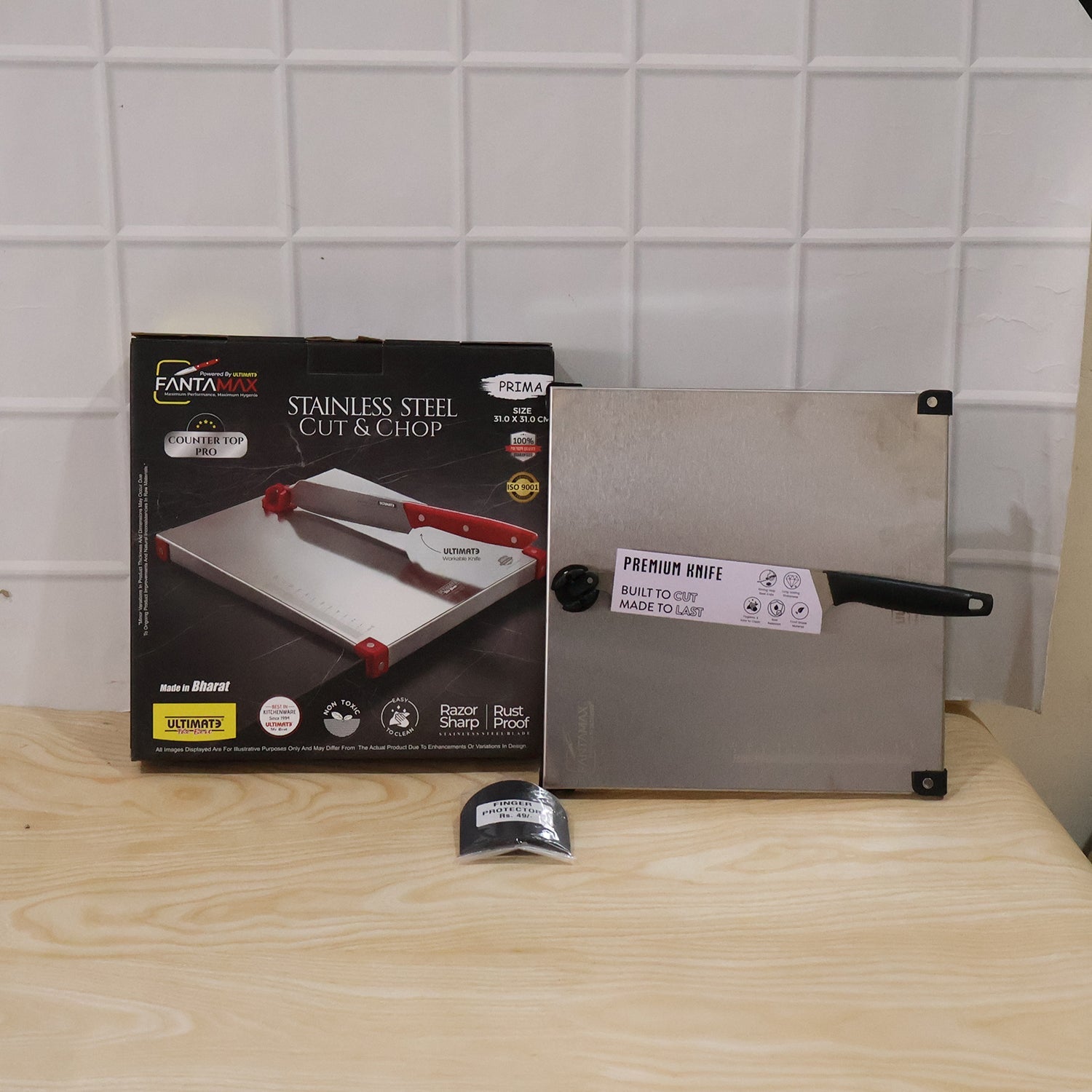 Wukusy stainless steel 2-in-1 cut and chop board with knife and sharpener, showing sleek design and included accessories.