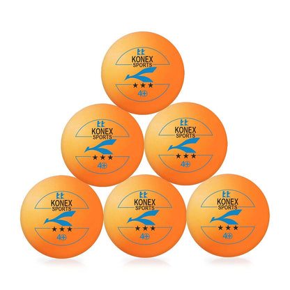 Six Wukusy professional table tennis balls laid out on a table, ready for competitive play in a sports setting.
