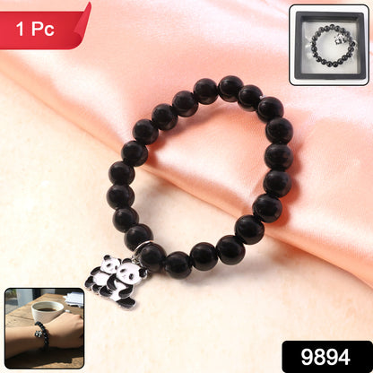 Black beaded stretch bracelet with a cute panda charm from Wukusy, featuring elastic design and charming panda detail.
