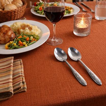 Set of 12 Wukusy premium stainless steel table spoons arranged on a wooden surface, showcasing sleek and polished design.