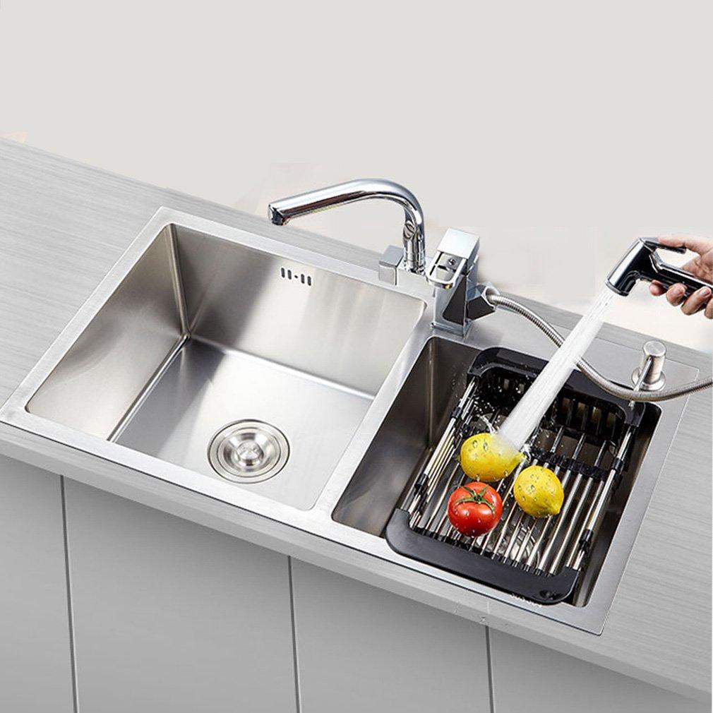 Wukusy stainless steel expandable kitchen sink dish drainer with multiple slots for drying dishes and utensils.