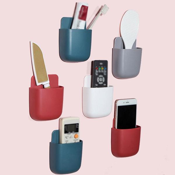Colorful Wukusy wall-mounted storage box for remote and mobile accessories, organized in a compact, multicolour design.