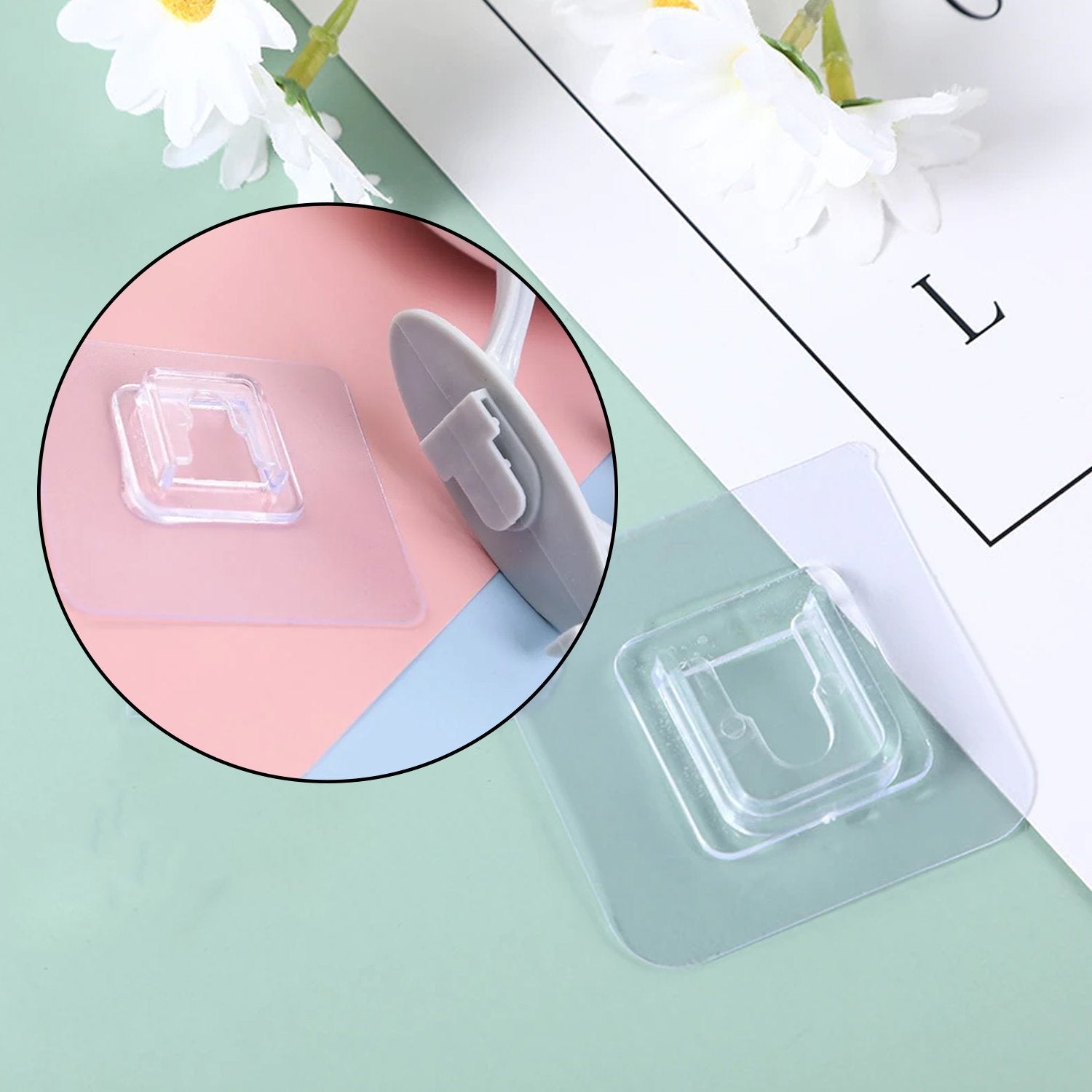 Wukusy 4687 self-adhesive plastic wall hook attached to a wall, ideal for home organization and easy installation.