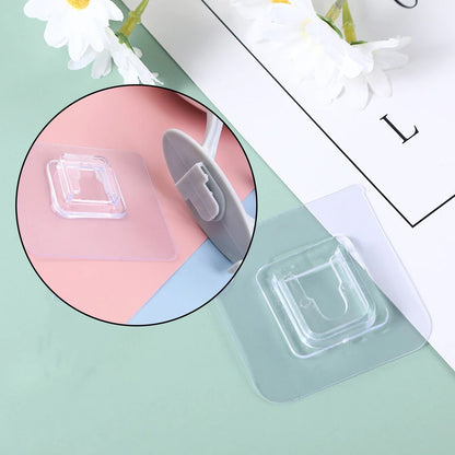 Wukusy 4687 self-adhesive plastic wall hook attached to a wall, ideal for home organization and easy installation.