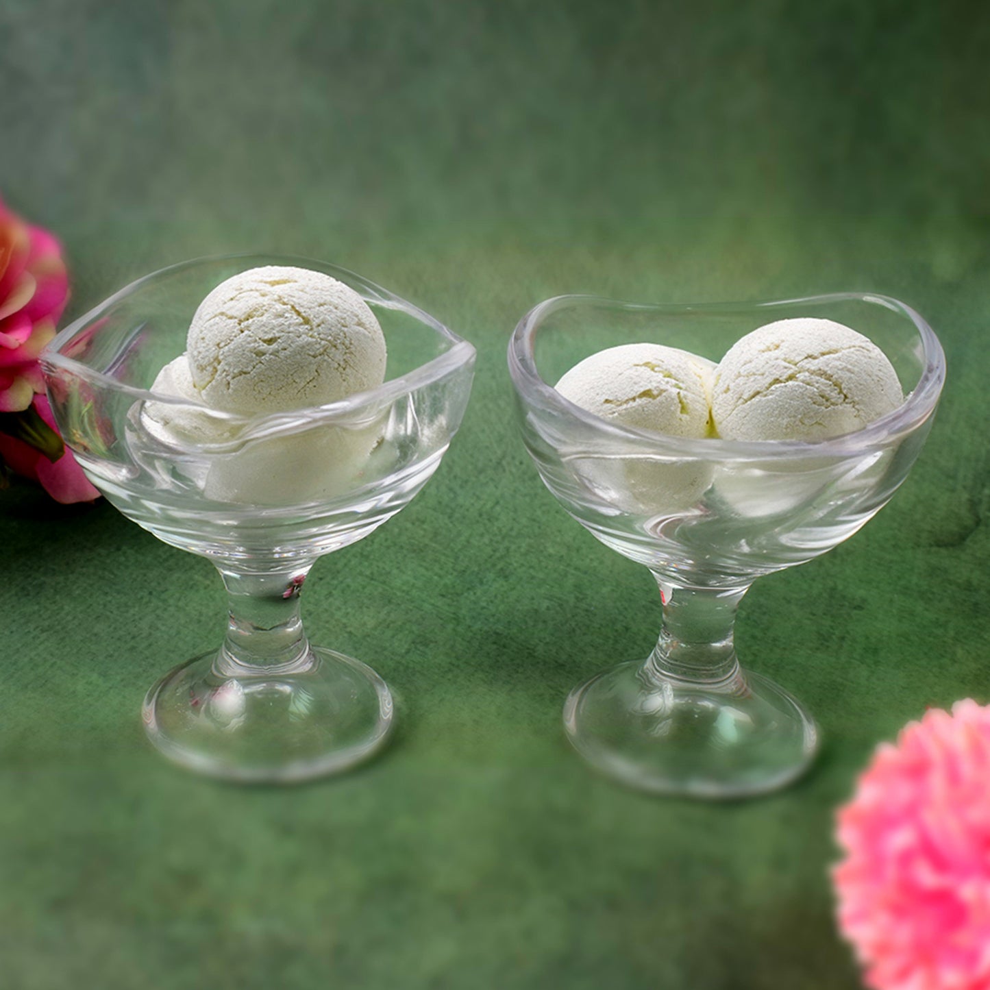Two clear glass footed dessert bowls with ice cream scoops, part of Wukusy 2-piece set, showcasing elegant design and footed base.