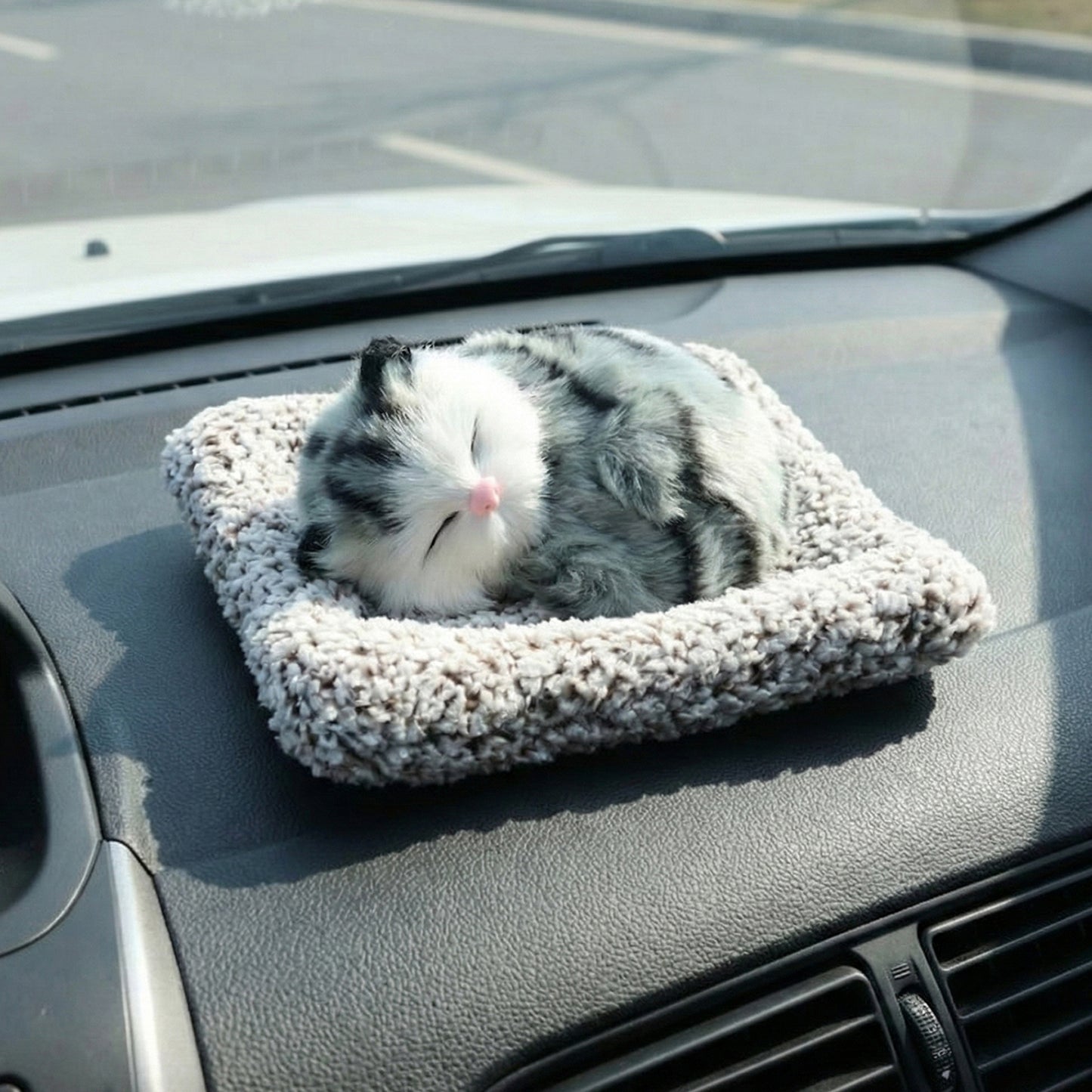 Soft plush Wukusy closed-eye cat dashboard toy with cute design, perfect for car decor and pet lovers.